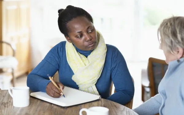 Social-worker-assessing-older-woman-iStock-532120326